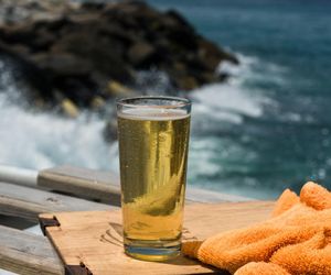 Glass of water on a table next to sport towel